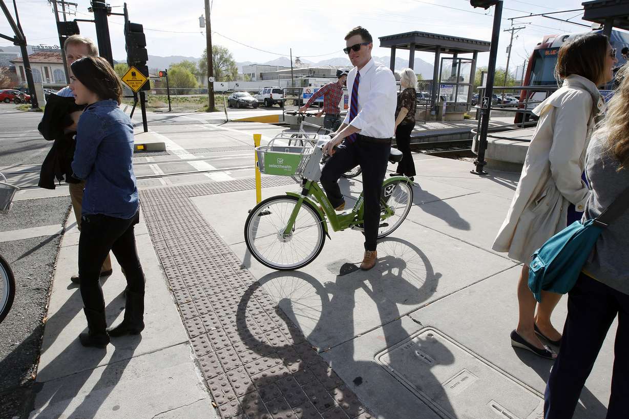 Jesse Dean rides a GREENbike on the opening day of its third season in Salt Lake City on Tuesday, March 31, 2015. At a press conference April 17, 2018, officials announced that in the last five years, the GREENbike program has offset more than 2.7 million pounds of CO2 and other pollutants from entering the air, and avoided 3 million vehicle miles from impacting local roads, while burning 49 million calories in the process. (Photo: Deseret News archives)