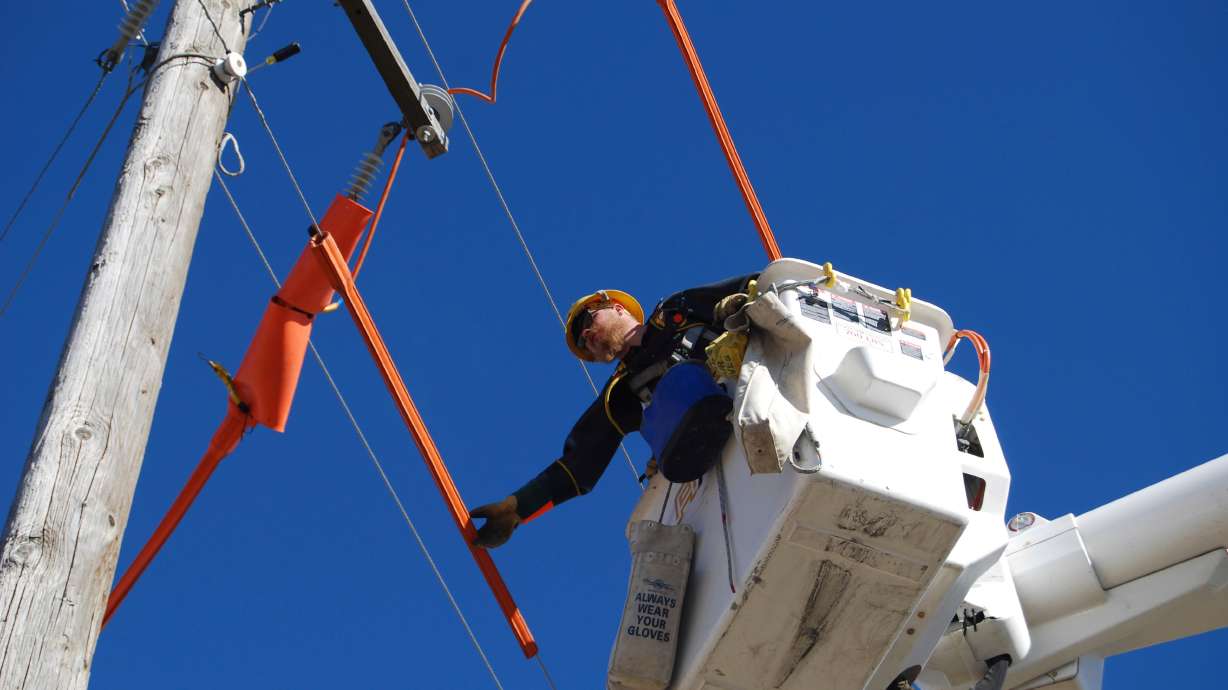 Idaho Power Co. apprentice lineman Claysen Hale prepares to change out jumpers and stirrups on a power line in Eden, Idaho. The Federal Energy Regulatory Commission this month said it will prepare a supplemental Environmental Impact Statement to consider new developments since it completed the 2007 document for Idaho Power's Hells Canyon Project.