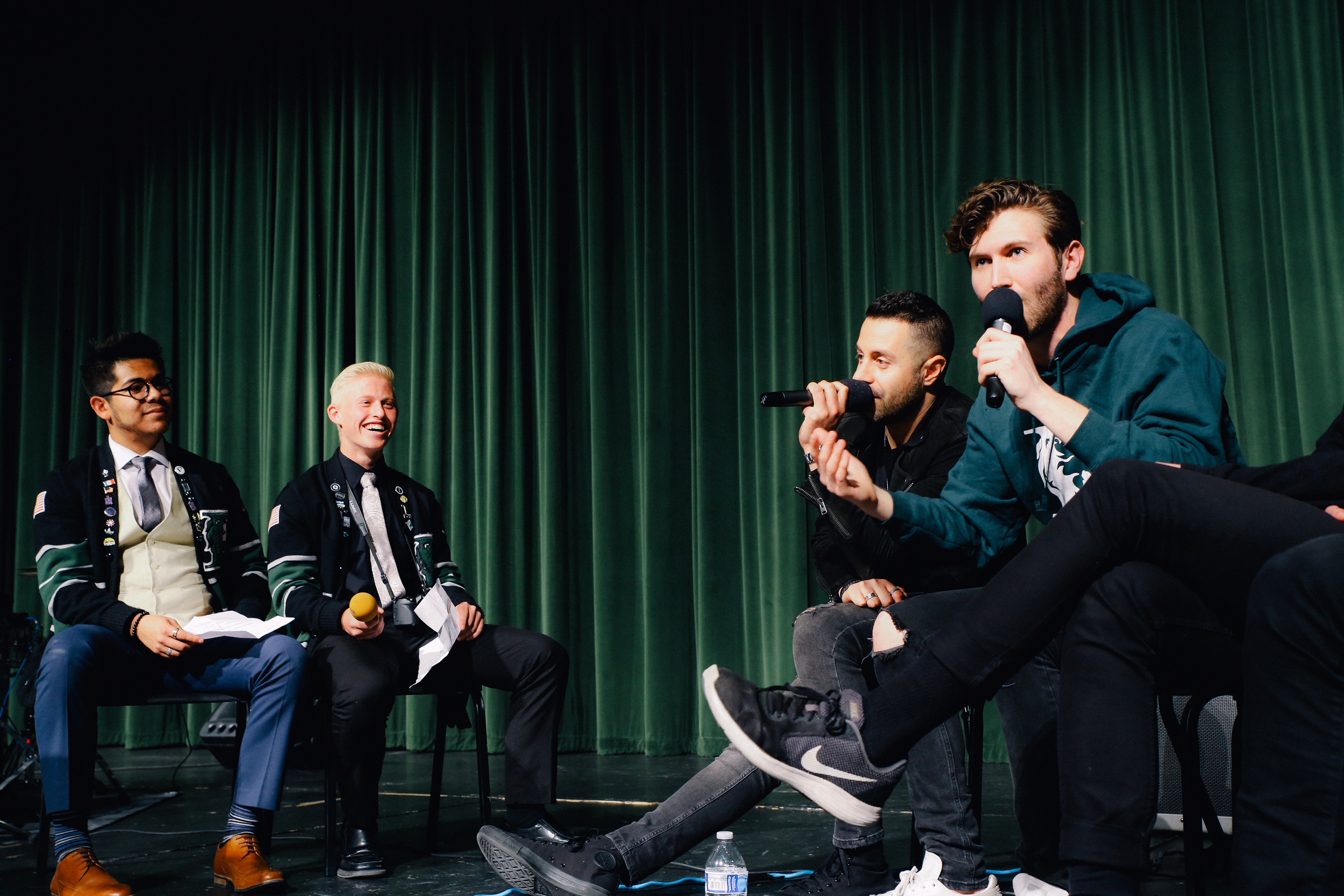 Los Angeles band The Score played a short concert on April 10 at the Payson High School auditorium and then held a question-and-answer session for students. Senior Jose Valle, left, won a contest the band held that focused on "Local Legends." (Photo: Azi Rahman)