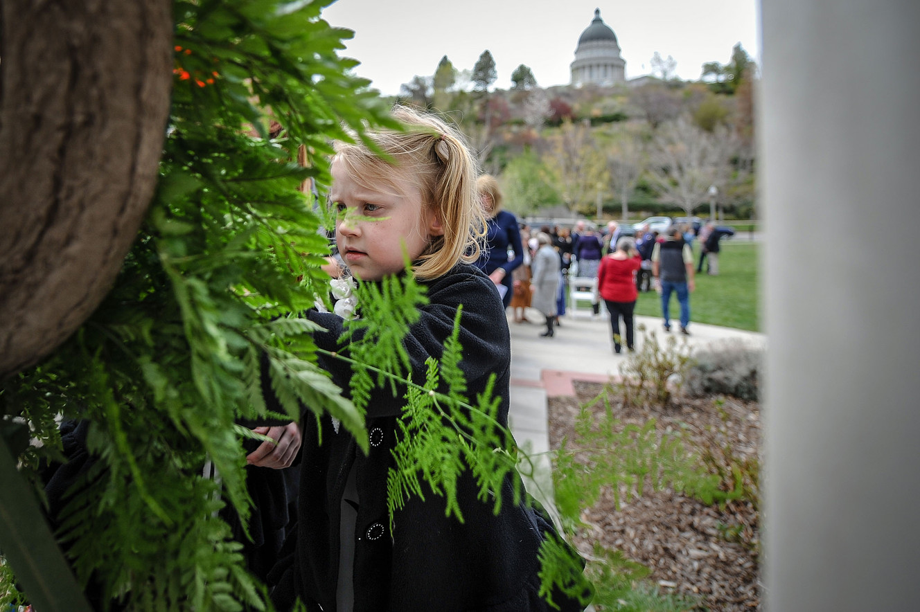 Swede Bullock places a poppy into a wreath at the World War I Memorial at Memory Grove Park in Salt Lake City on Thursday, April 19, 2018. The wreath-laying ceremony, hosted by the Utah State Society of the National Society of the Daughters of the American Revolution, commemorated the 100th anniversary of the signing of the Treaty of Versailles in 1918. (Photo: Adam Fondren, KSL)