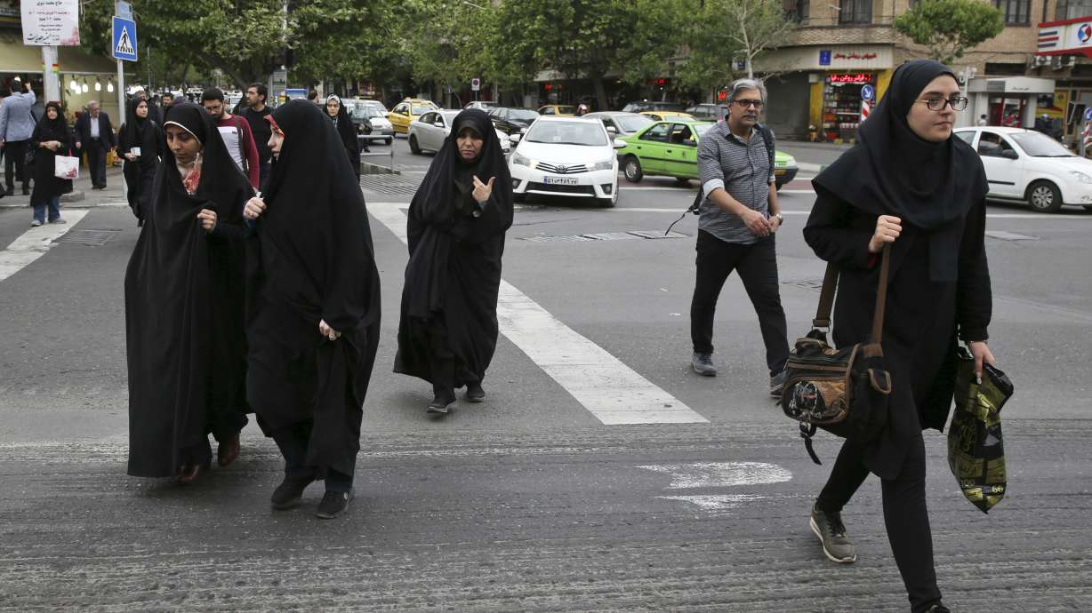 Iran police's assault on woman over headscarf stirs debate