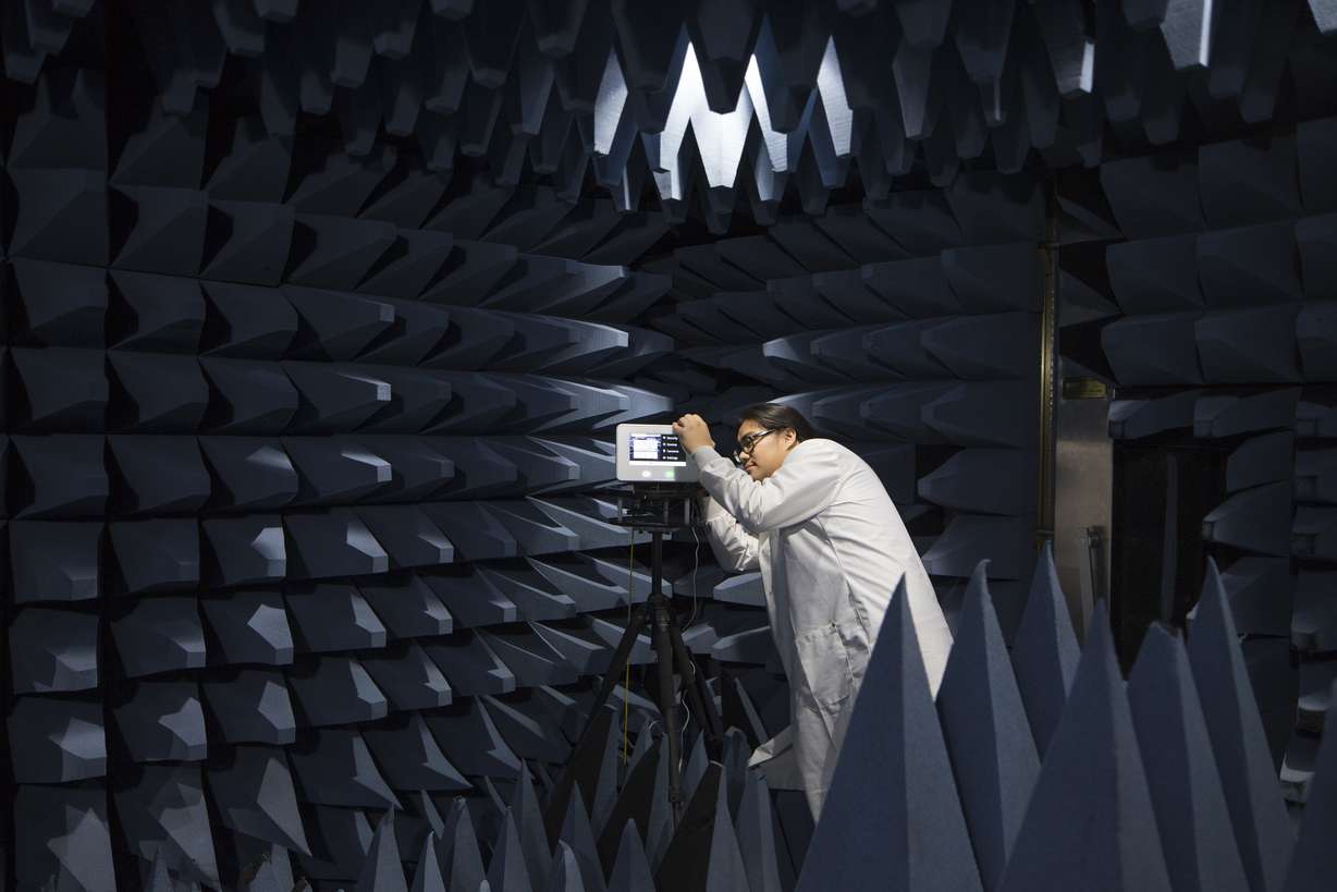 Employee testing a product in an anechoic chamber at the Innovation Center in Lehi