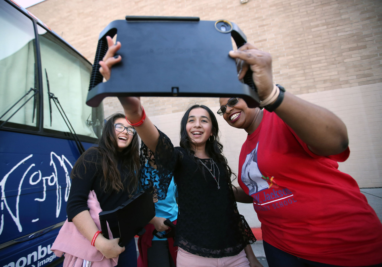 Daja Concha, Marisol Serrano and Wanda Jackson take a selfie outside of The John Lennon Educational Bus Tour at Mary Jackson Elementary School in Salt Lake City on Thursday, April 26, 2018. Jackson is the granddaughter of Mary Jackson. (Photo: Kristin Murphy, KSL)