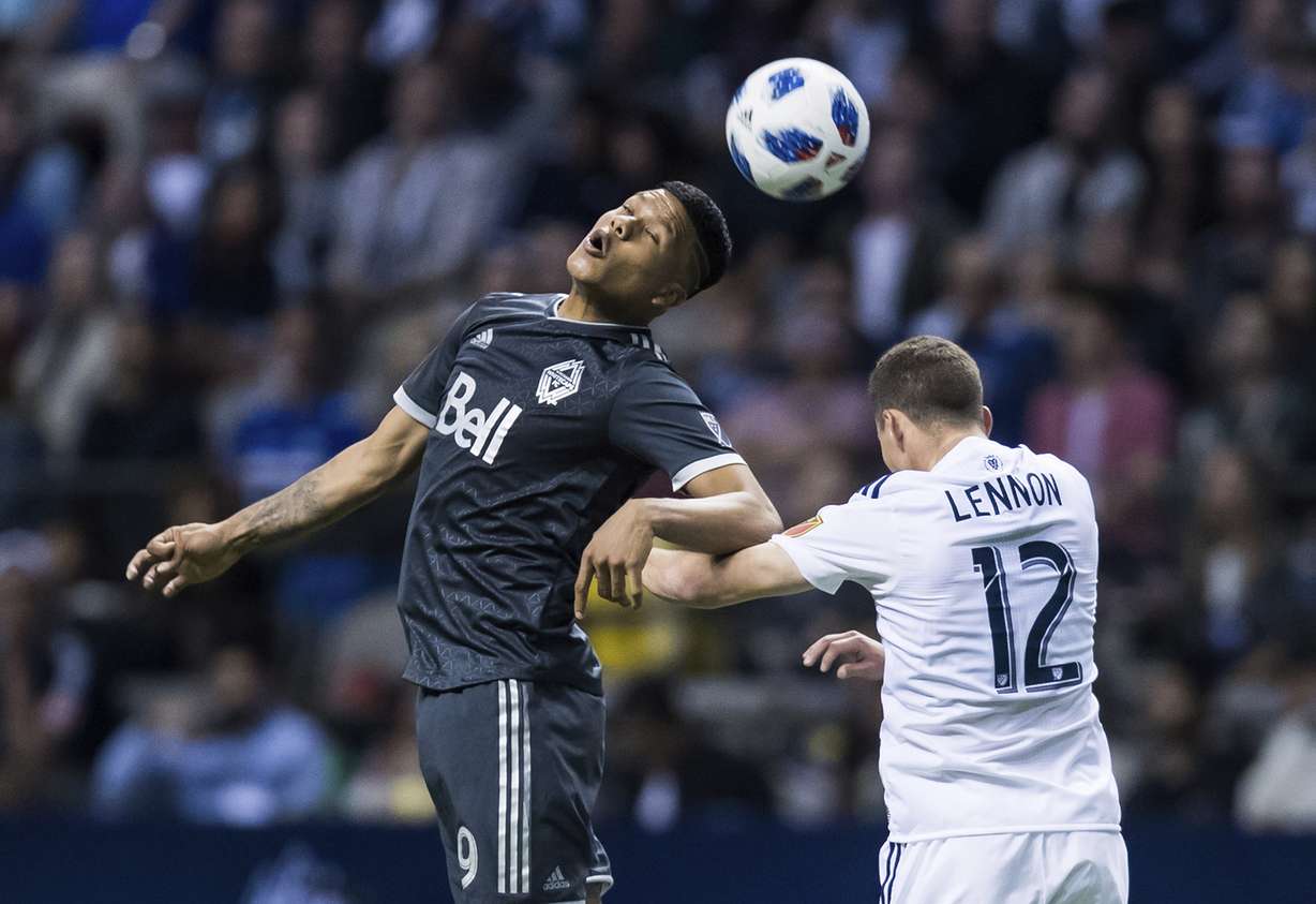 Vancouver Whitecaps' Anthony Blondell, left, gets his head on the ball next to Real Salt Lake's Brooks Lennon during the second half of an MLS soccer match Friday, April 27, 2018, in Vancouver, British Columbia. (Photo: Darry Dyck: The Canadian Press via AP)