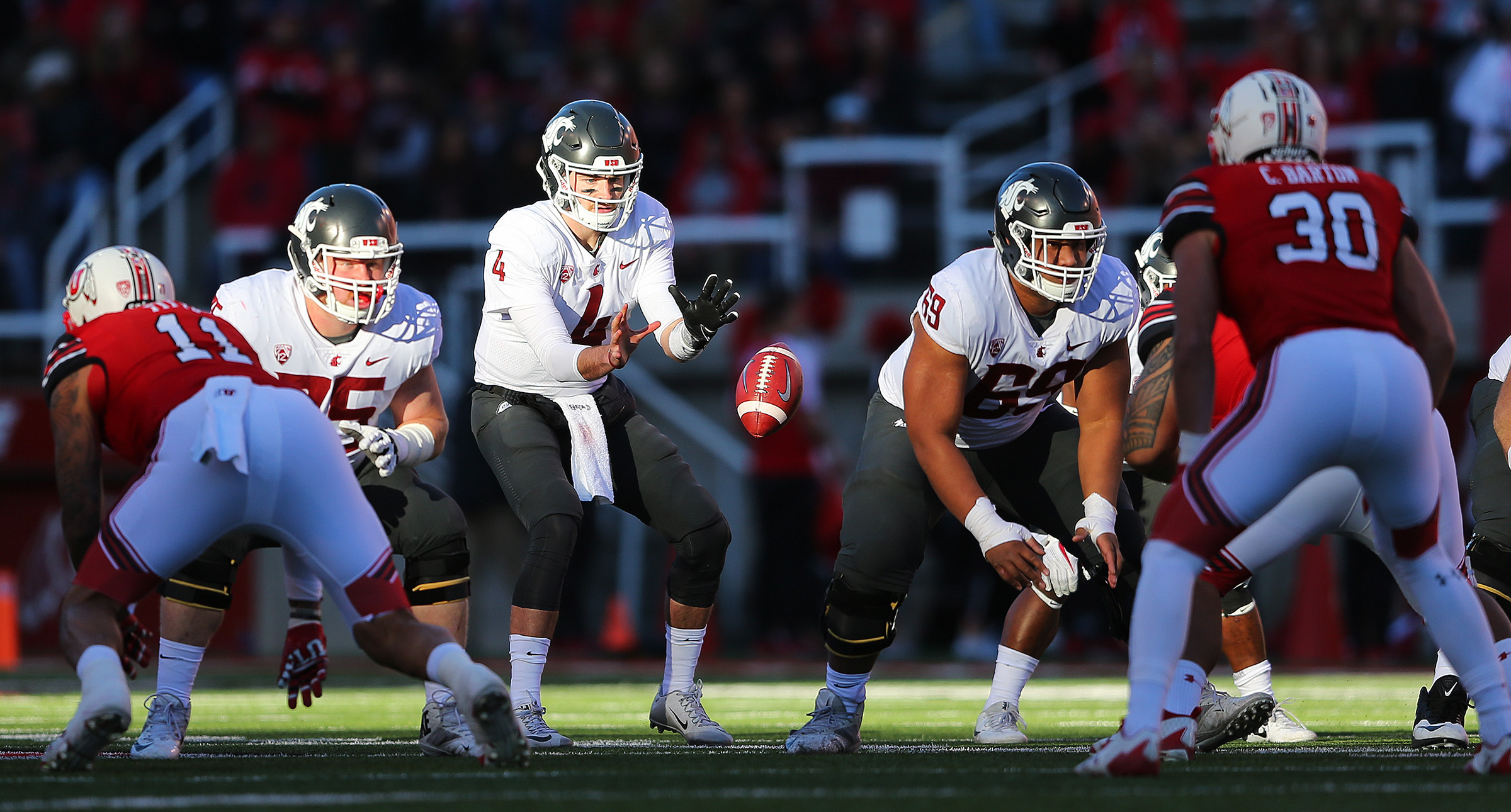 Former Logan High player and current Washington State quarterback (4) Luke Falk takes a snap as Utah and Washington State play a College football game at Rice Eccles Stadium at the University of Utah in Salt Lake City on Saturday, Nov. 11, 2017. (Photo: Scott G Winterton, Deseret News)