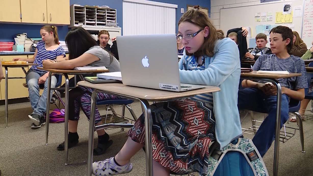 Under a program offered by the Utah Schools for the Deaf and the Blind, deaf students in remote areas are receiving live interpreting services throughout the day on their tablets. At Piute High School, the program has aided sophomore Kaylee Miller (center) through subjects like history. (Photo: KSL TV)
