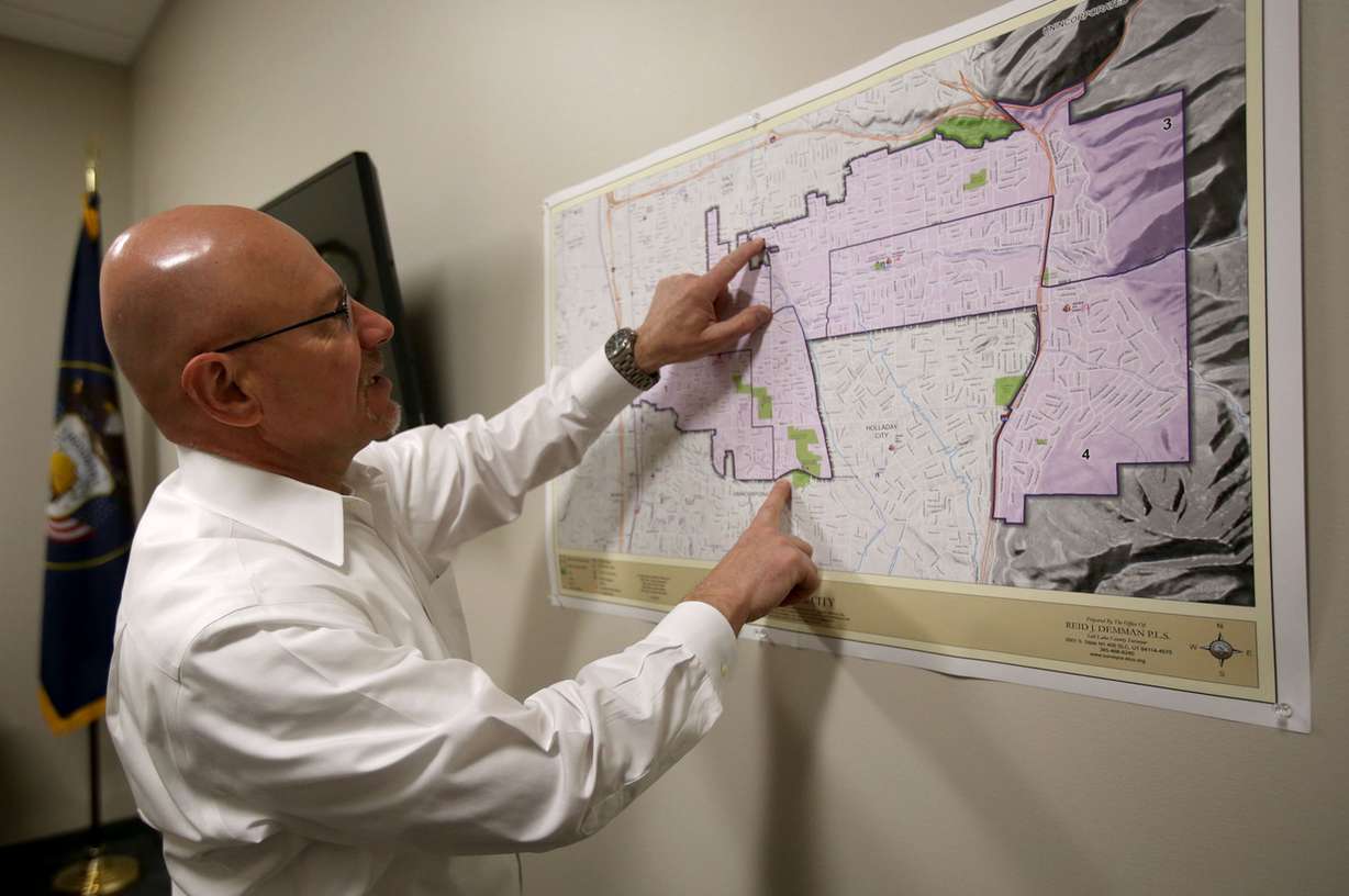 Millcreek Mayor Jeff Silvestrini uses a map of Millcreek to show the location of a proposed development project in Millcreek on Thursday, April 26, 2018. (Photo: Kristin Murphy, KSL)