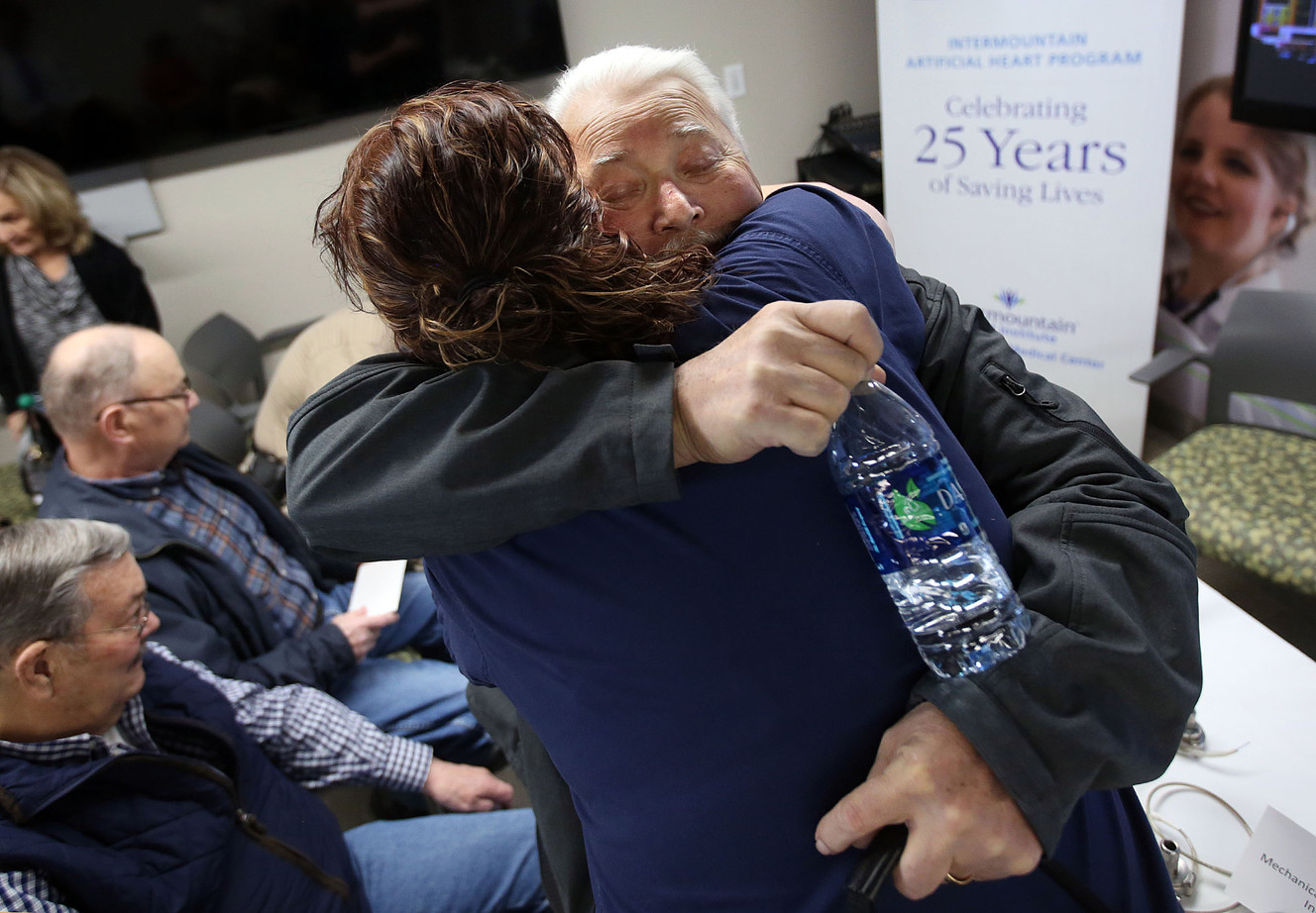 Keith Hall, who has a left ventricular assist device, or LVAD, hugs Katherine Dockery, an LVAD nurse, at a 25th anniversary celebration for Intermountain Medical Center's artificial heart program at the hospital's Doty Education Center in Murray on Tuesday, May 1, 2018. (Photo: Kristin Murphy, KSL)