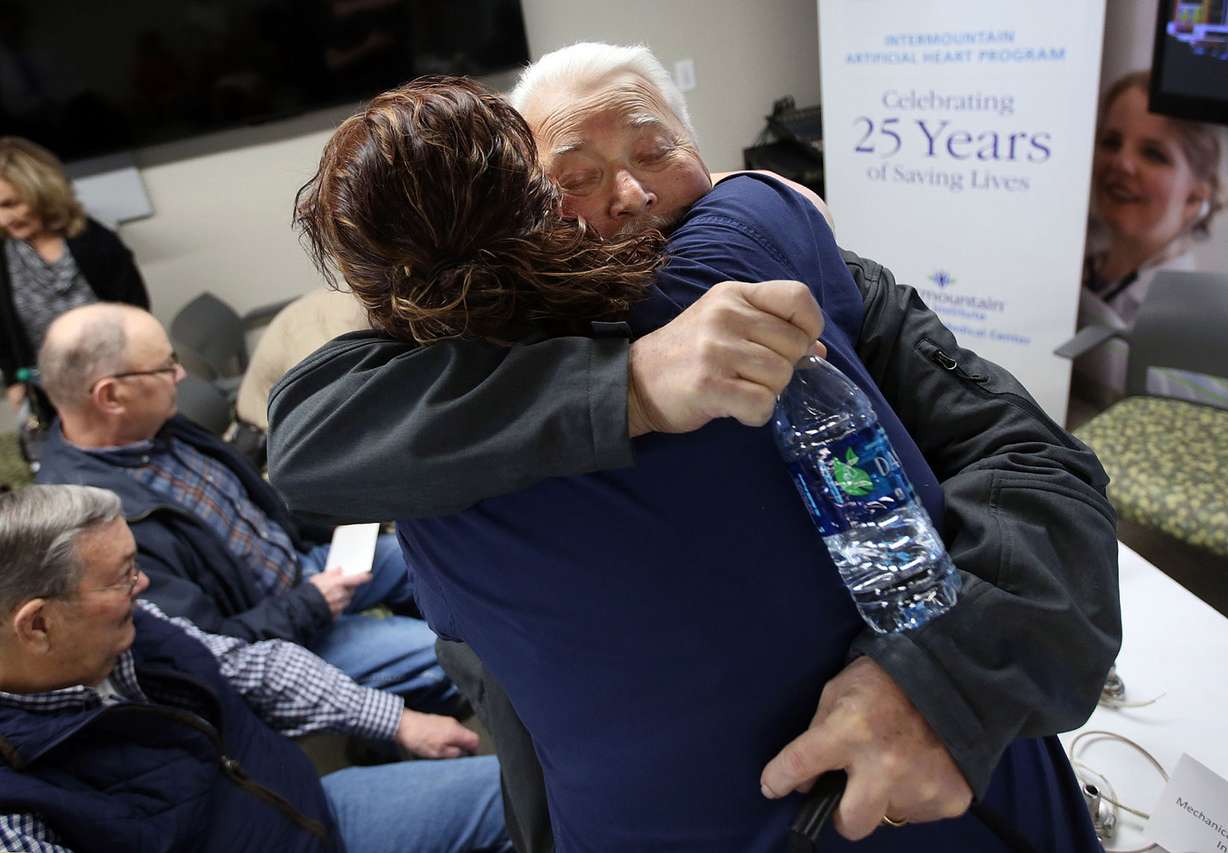 Keith Hall, who has a left ventricular assist device, or LVAD, hugs Katherine Dockery, an LVAD nurse, at a 25th anniversary celebration for Intermountain Medical Center's artificial heart program at the hospital's Doty Education Center in Murray on Tuesday, May 1, 2018. (Photo: Kristin Murphy, KSL)