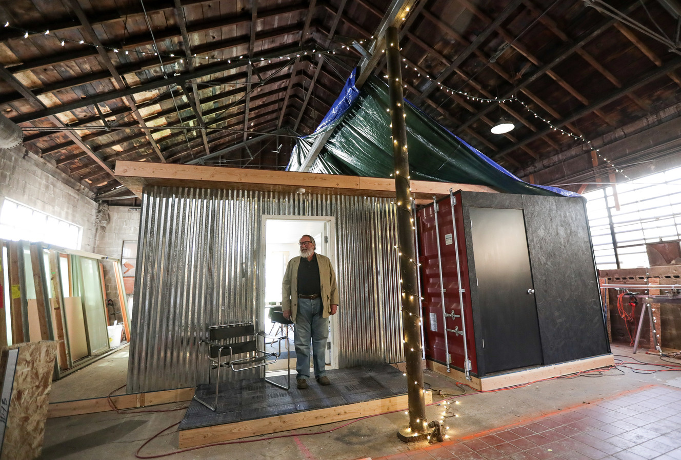 Jeff White shows off a model shipping container home inside his shop in Salt Lake City on Friday, May 4, 2018. (Photo: Spenser Heaps, KSL)