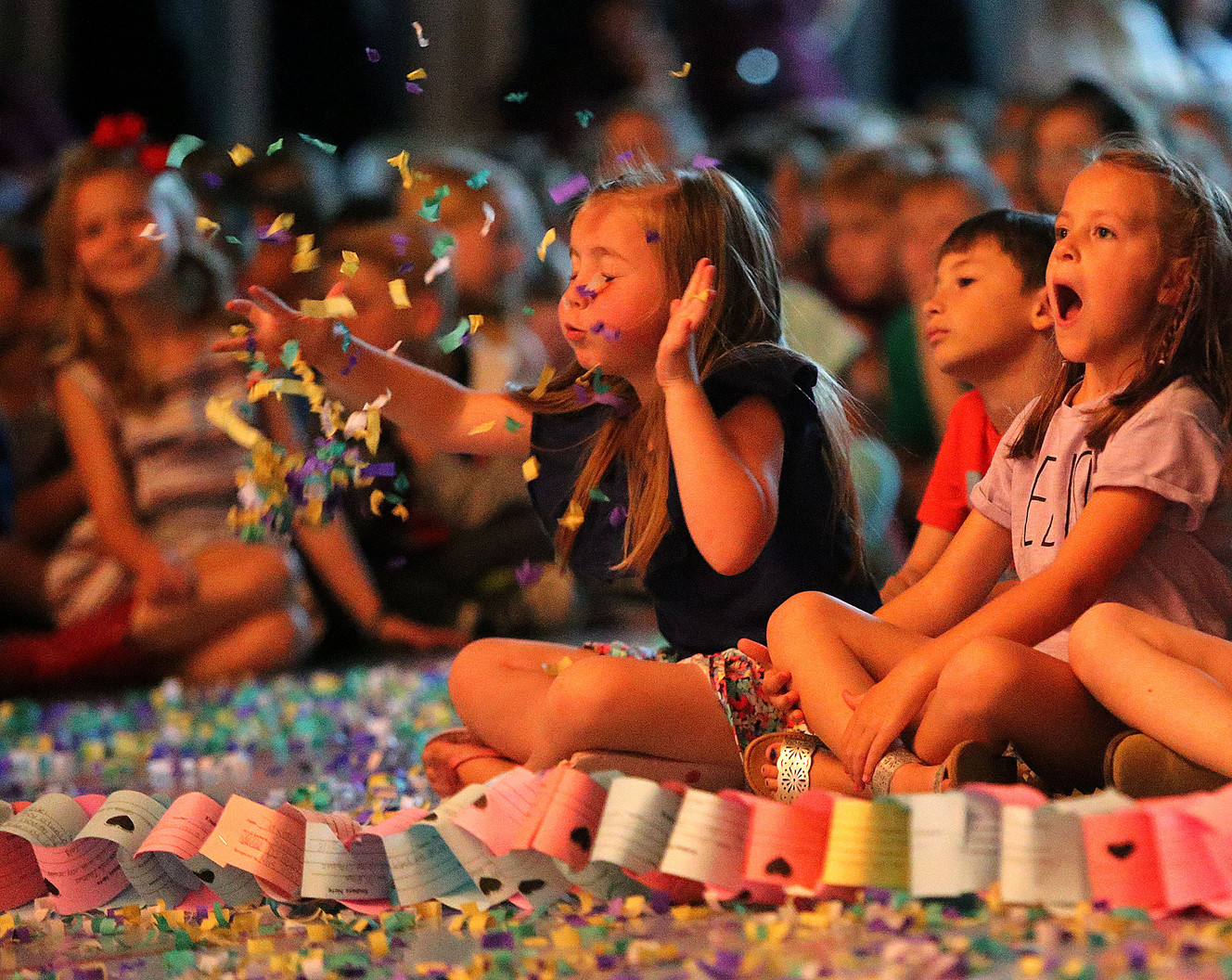 Kindergartner Brielle Prescott blows confetti during a kindness assembly at Foothills Elementary School in Riverton on Monday, May 7, 2018. Indi Jones is on the right. (Photo: Kristin Murphy, KSL)