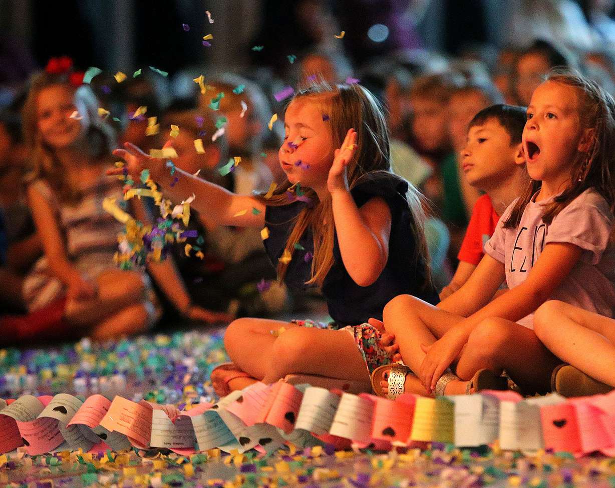 Kindergartner Brielle Prescott blows confetti during a kindness assembly at Foothills Elementary School in Riverton on Monday, May 7, 2018. Indi Jones is on the right. (Photo: Kristin Murphy, KSL)
