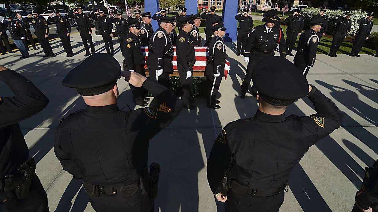 Indiana police officer killed in shootout honored as a hero