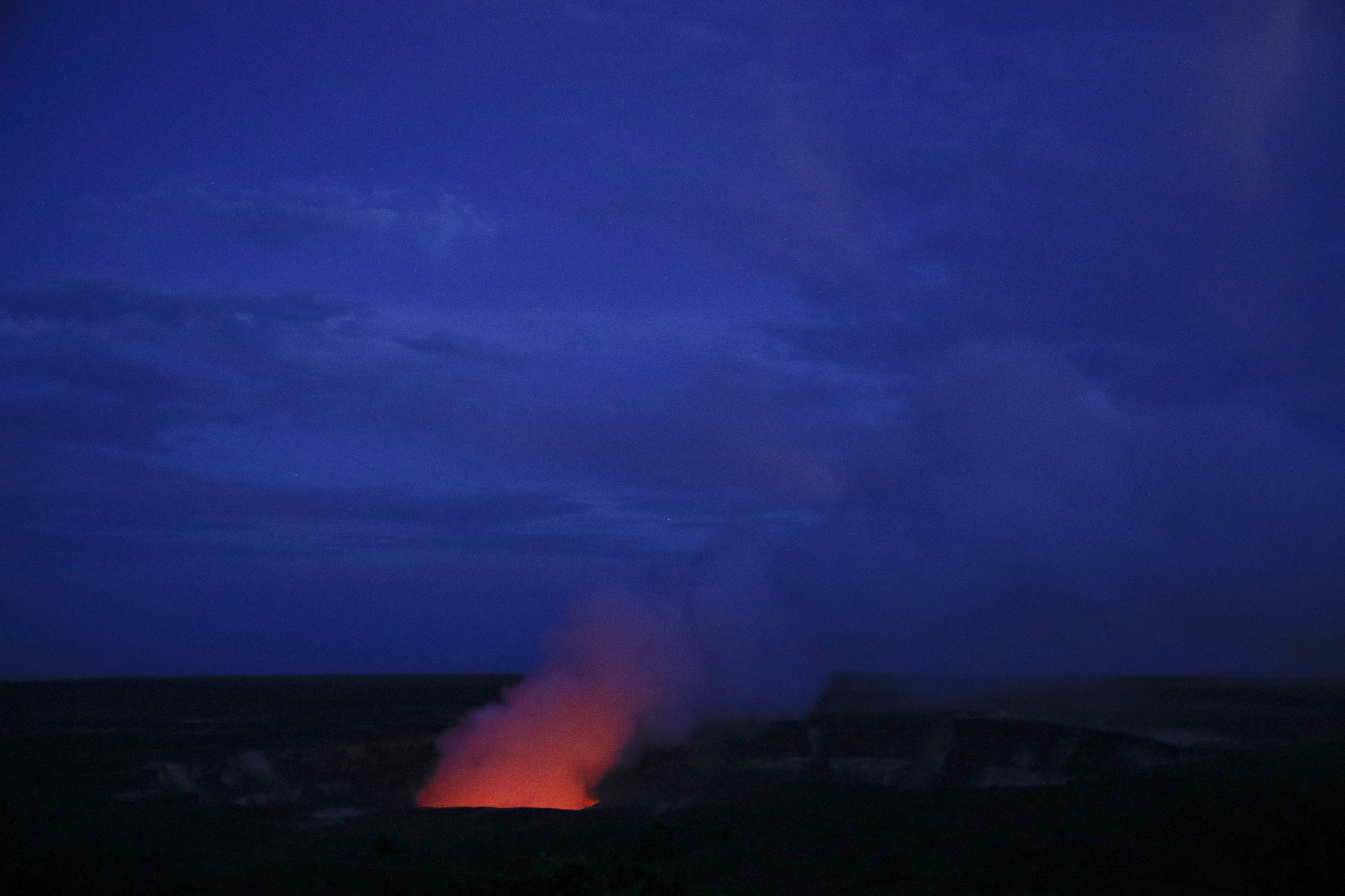 Kilauea's summit crater glows red in Volcanoes National Park, Hawaii. Wednesday, May 9, 2018. Geologists warned Wednesday that Hawaii's Kilauea volcano could erupt explosively and send boulders, rocks and ash into the air around its summit in the coming weeks. (Jae C. Hong, AP Photo)