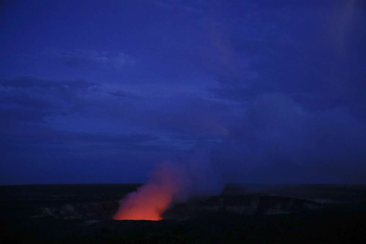 Kilauea's summit crater glows red in Volcanoes National Park, Hawaii. Wednesday, May 9, 2018. Geologists warned Wednesday that Hawaii's Kilauea volcano could erupt explosively and send boulders, rocks and ash into the air around its summit in the coming weeks. (Jae C. Hong, AP Photo)