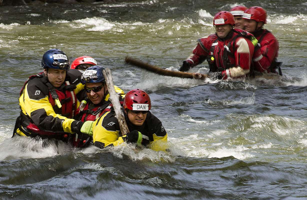 Unified Fire Authority's paramedics and firefighters practice the shallow water crossing technique during swift-water rescue training in the Provo River on Thursday, May 10, 2018. (Photo: Laura Seitz, KSL)