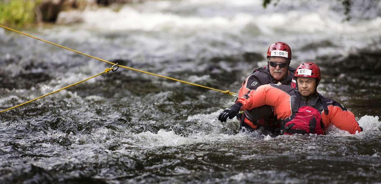 FILE - Unified Fire Authority's Todd Burrows and Ed Arriola practice rescue drills during swift-water rescue training in the Provo River on Thursday, May 10, 2018. (Photo: Laura Seitz, KSL)