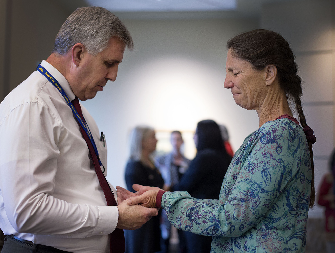Jody Davis, a chaplain with Rocky Mountain Hospice, left, prays with caregiver Robin Roberts during a Blessing of the Hands at the Huntsman Cancer Institute in Salt Lake City on Friday, May 11, 2018. (Photo: Laura Seitz, KSL)