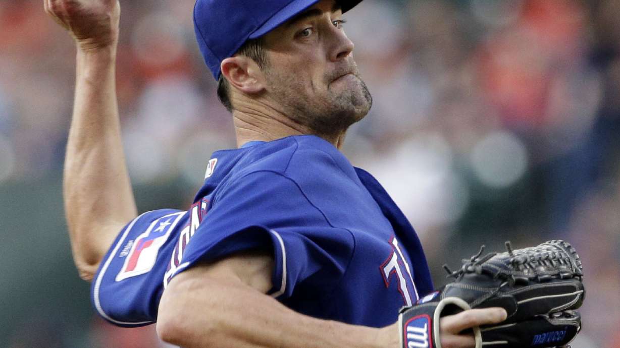 Hamels shines in Rangers' 1-0 win over Astros; Springer hurt