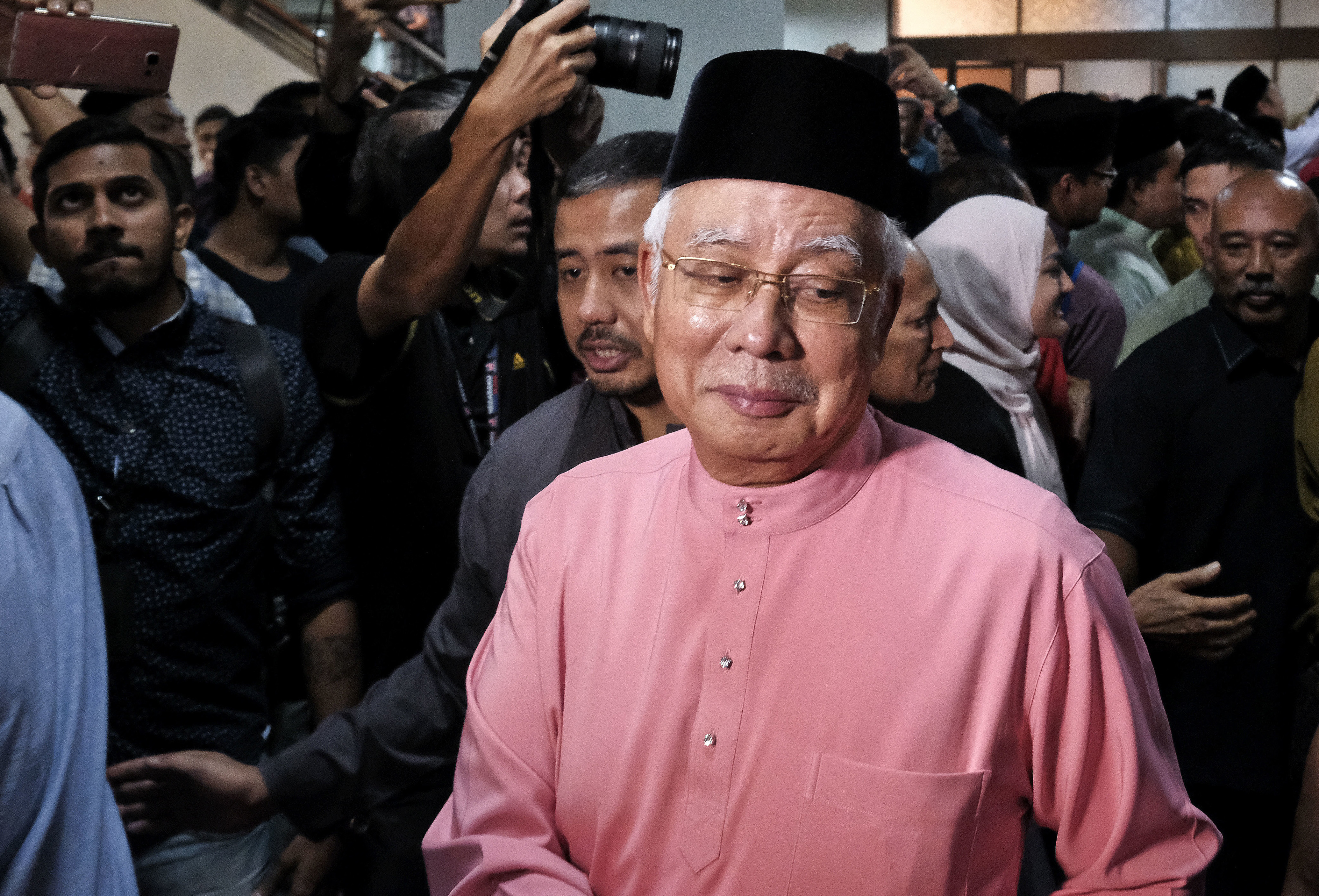 The Latest: Defeated Malaysian leader resigns from his party