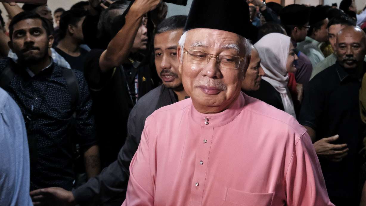 The Latest: Defeated Malaysian leader resigns from his party