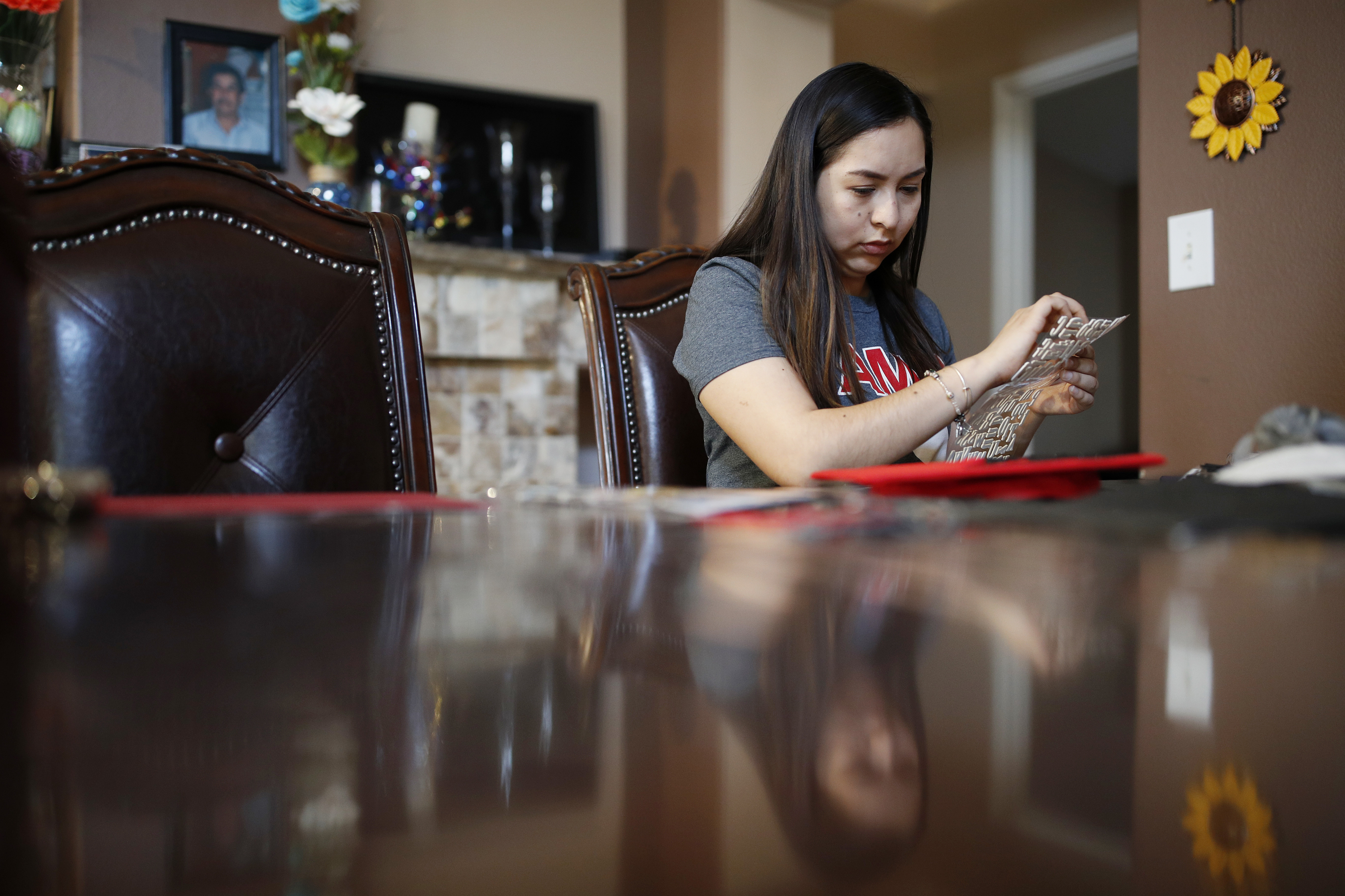 Decorated graduation caps reflect joy, angst of students