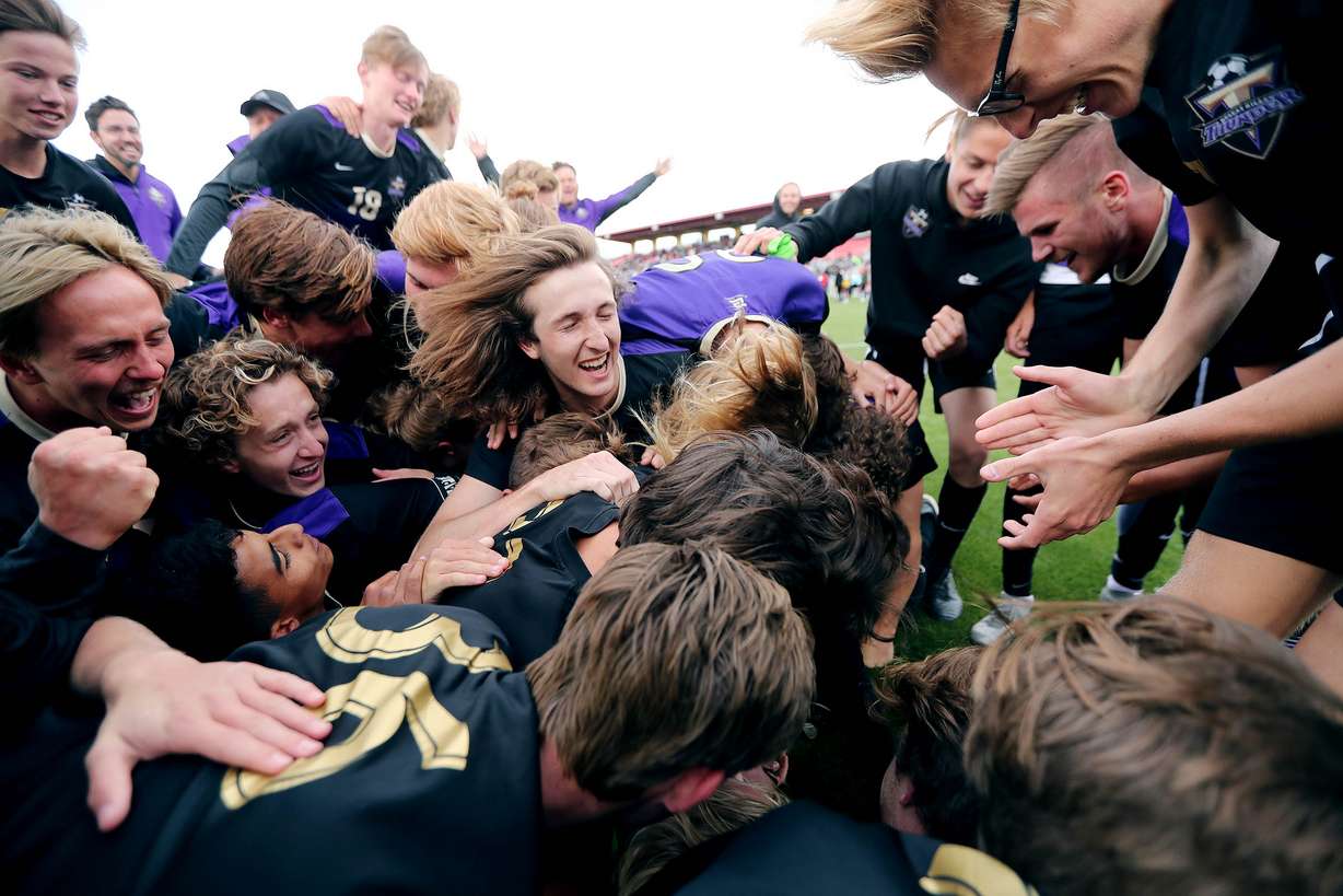 Desert Hills players and coaches celebrate as they claim their first state title in school history with a 4-0 win over Park City in Herriman on Saturday, May 12, 2018. (Photo: Scott G Winterton, Deseret News)