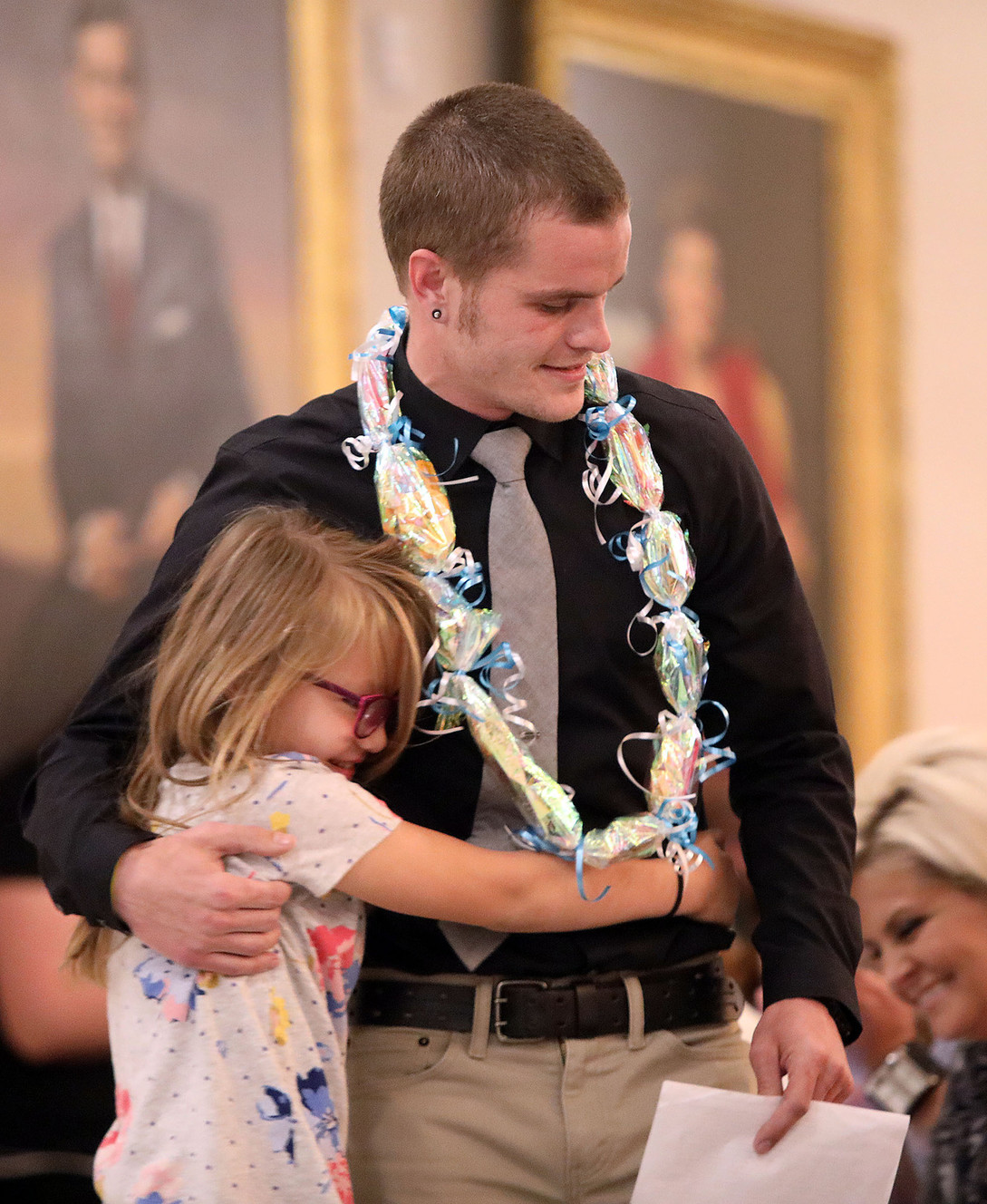 Aryana Schickling hugs her father, Darcin Schickling, after he spoke at a combined graduation ceremony for Salt Lake County's Drug Courts at the Capitol in Salt Lake City on Monday, May 14, 2018. (Photo: Kristin Murphy, KSL)