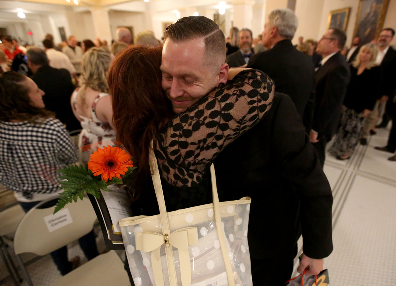 Christine Carlisle hugs her son Adam Carlisle after his graduation during a combined ceremony for Salt Lake County's Drug Courts at the Capitol in Salt Lake City on Monday, May 14, 2018. (Photo: Kristin Murphy, KSL)