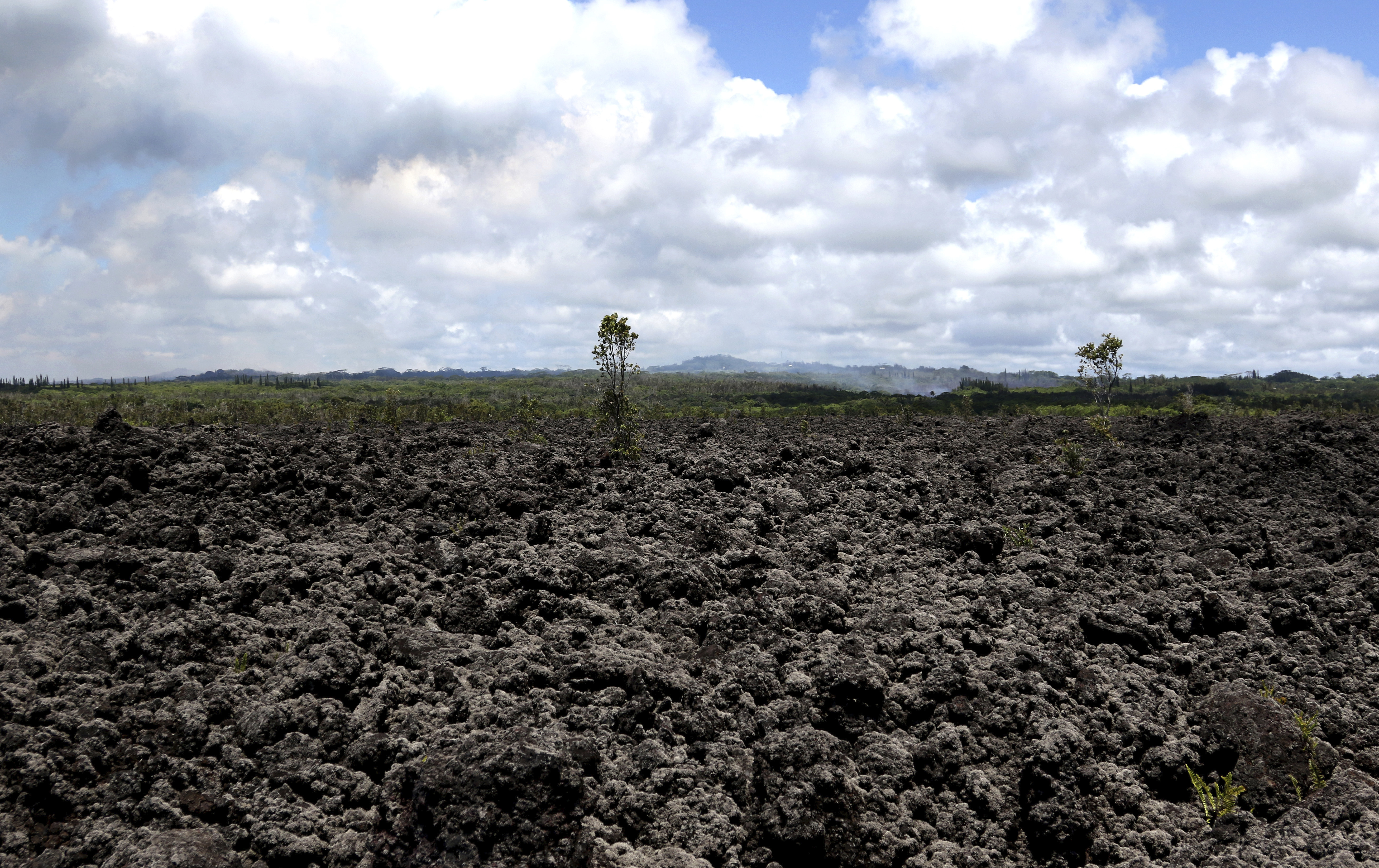The Latest: Volcano ash plume rises to 12,000 feet