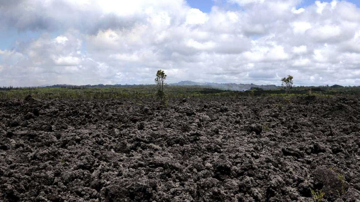 The Latest: Volcano ash plume rises to 12,000 feet