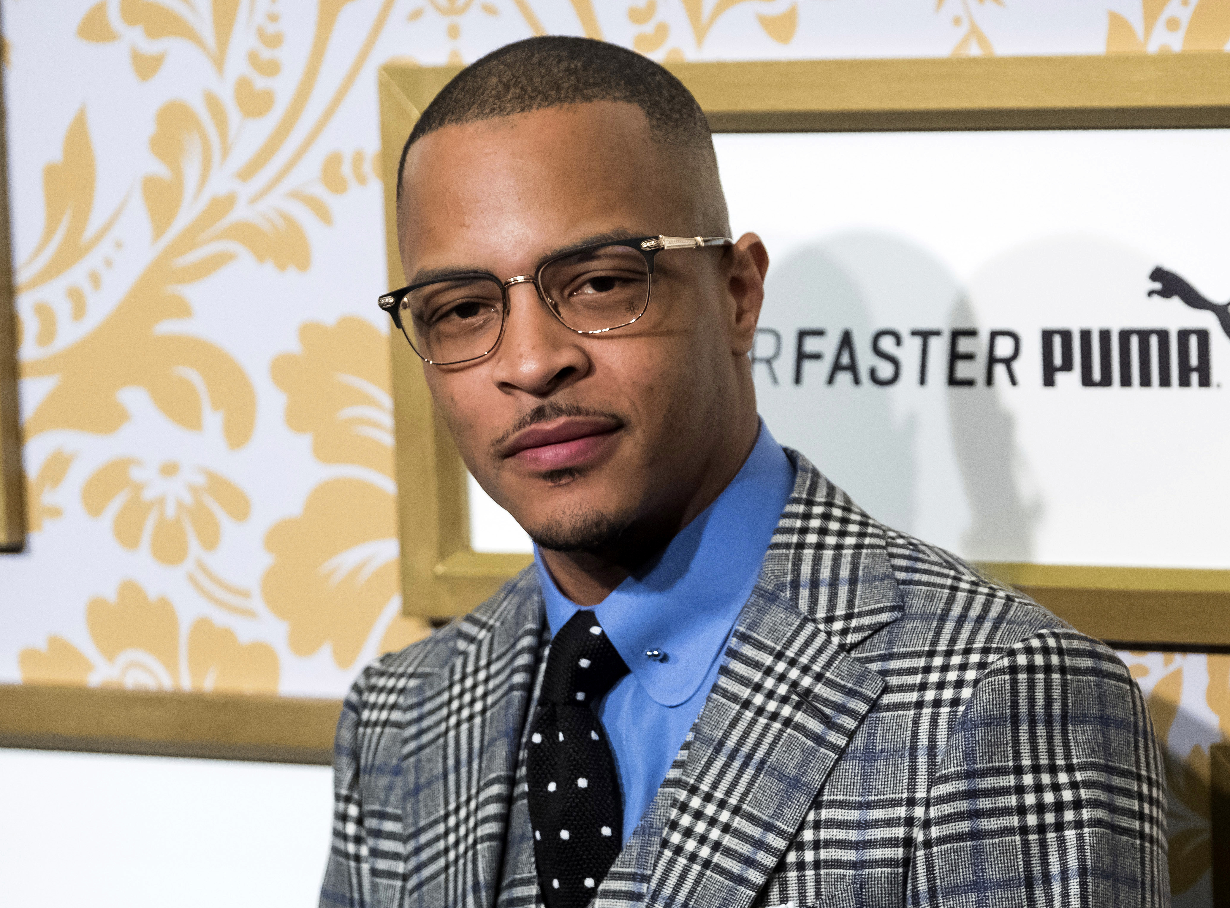 The Latest: Rapper T.I. arrested outside his gated community