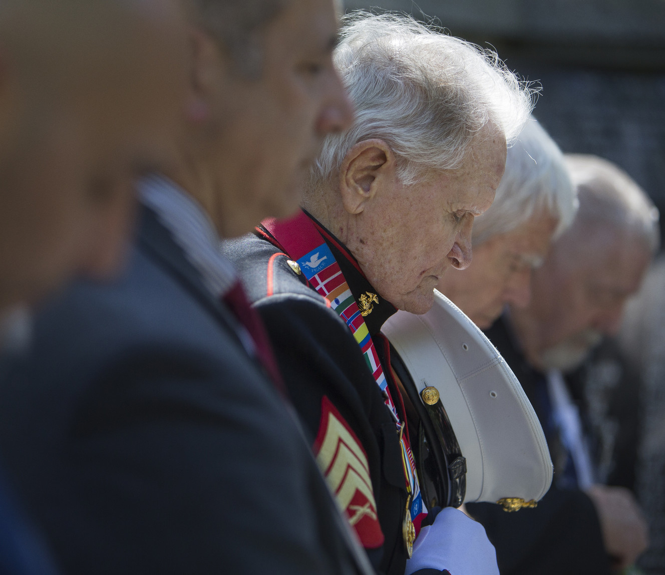 World War II and Korean War Marine veteran John Cole, of Roy, bows his head during a prayer at the beginning of a Korean War memorial ceremony at Memory Grove Park in Salt Lake City on Wednesday, May 16, 2018. (Photo: Jacob Wiegand, KSL)