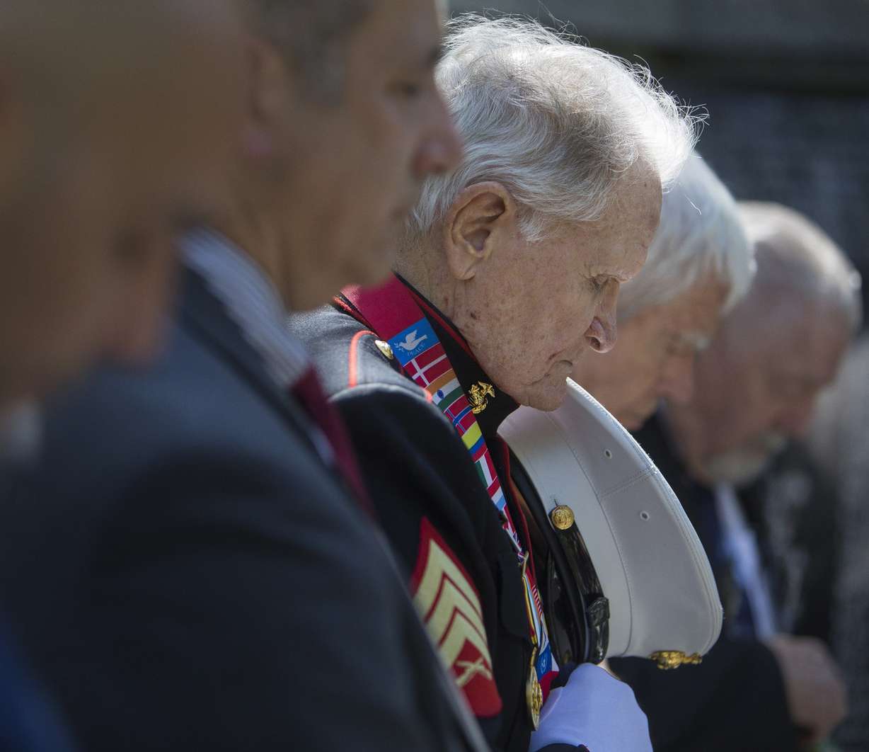 World War II and Korean War Marine veteran John Cole, of Roy, bows his head during a prayer at the beginning of a Korean War memorial ceremony at Memory Grove Park in Salt Lake City on Wednesday, May 16, 2018. (Photo: Jacob Wiegand, KSL)