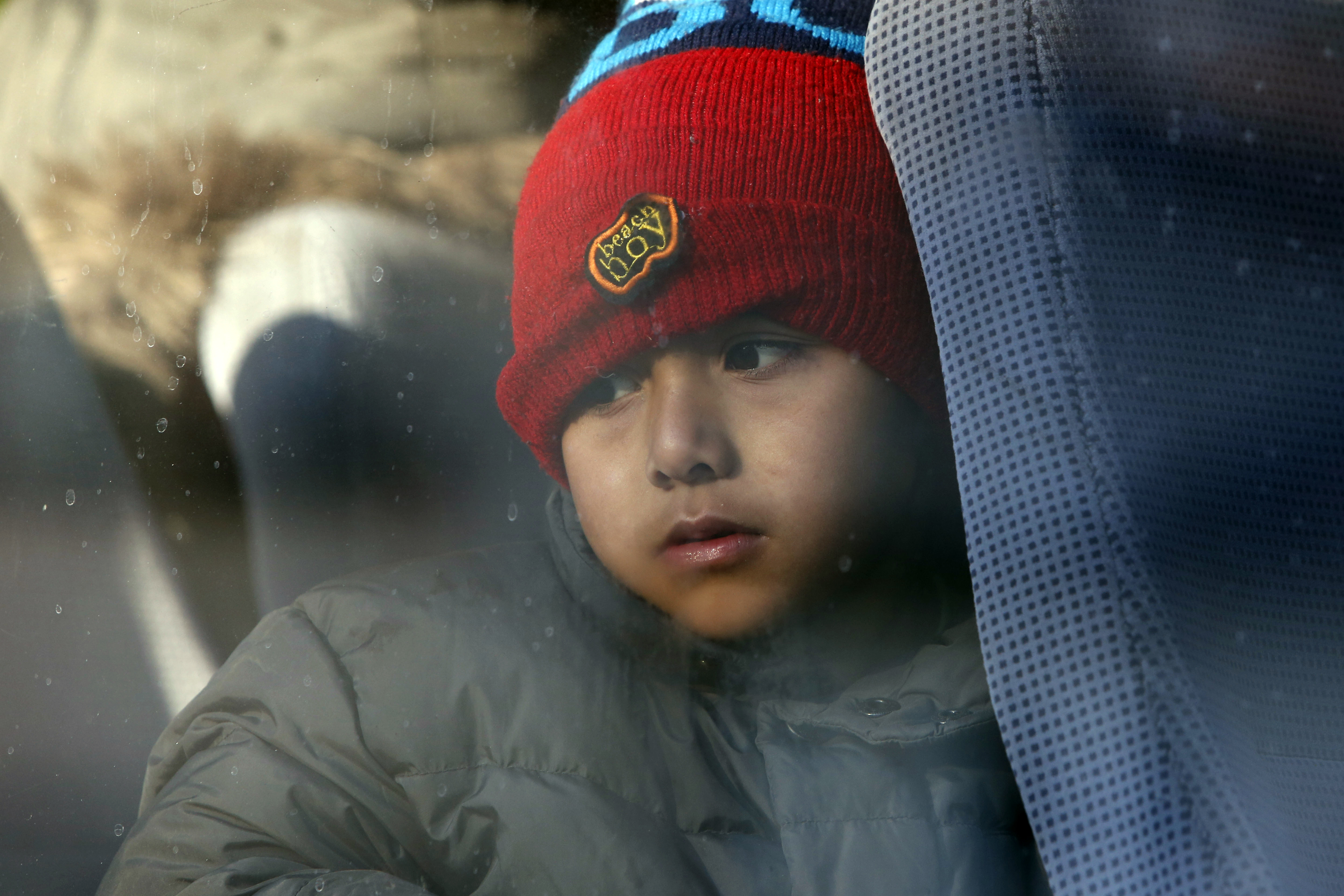 The Latest: Buses with migrants heading toward Bosnia camp