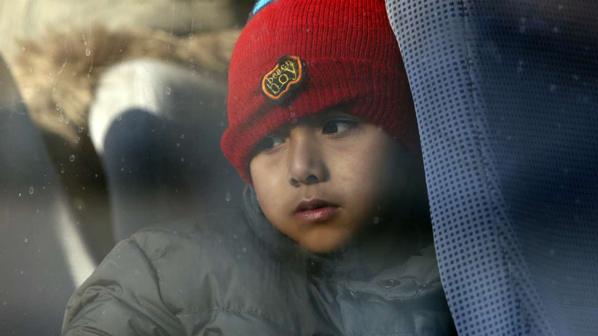 The Latest: Buses with migrants heading toward Bosnia camp