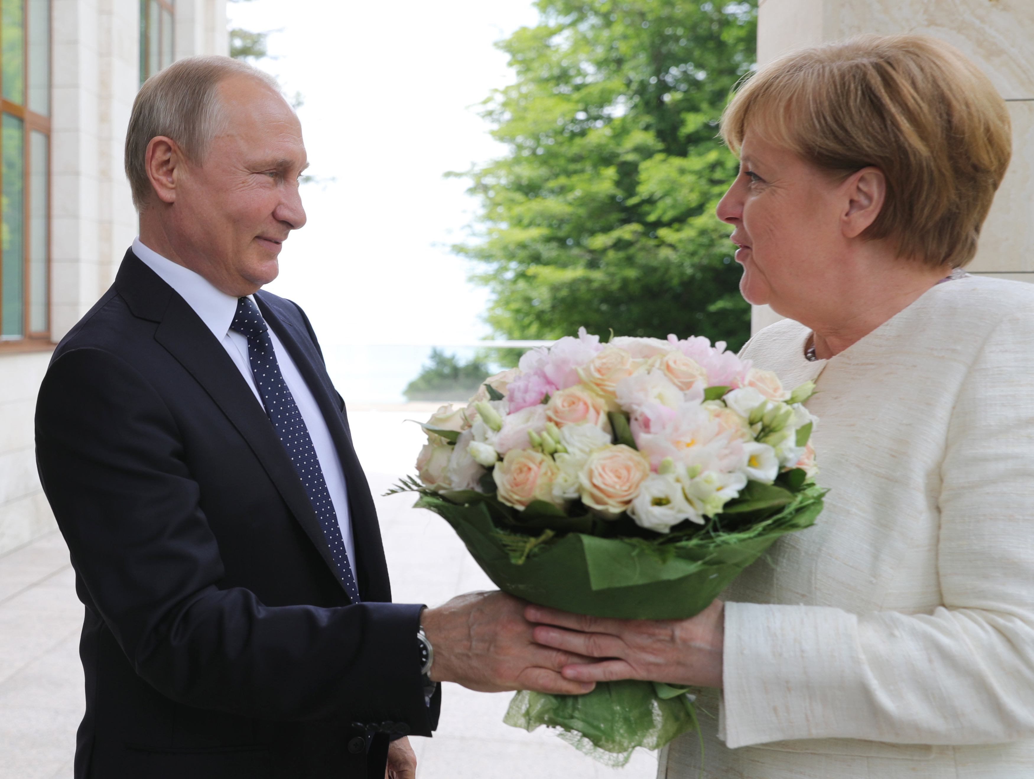 The Latest: Putin says gas may keep going via Ukraine