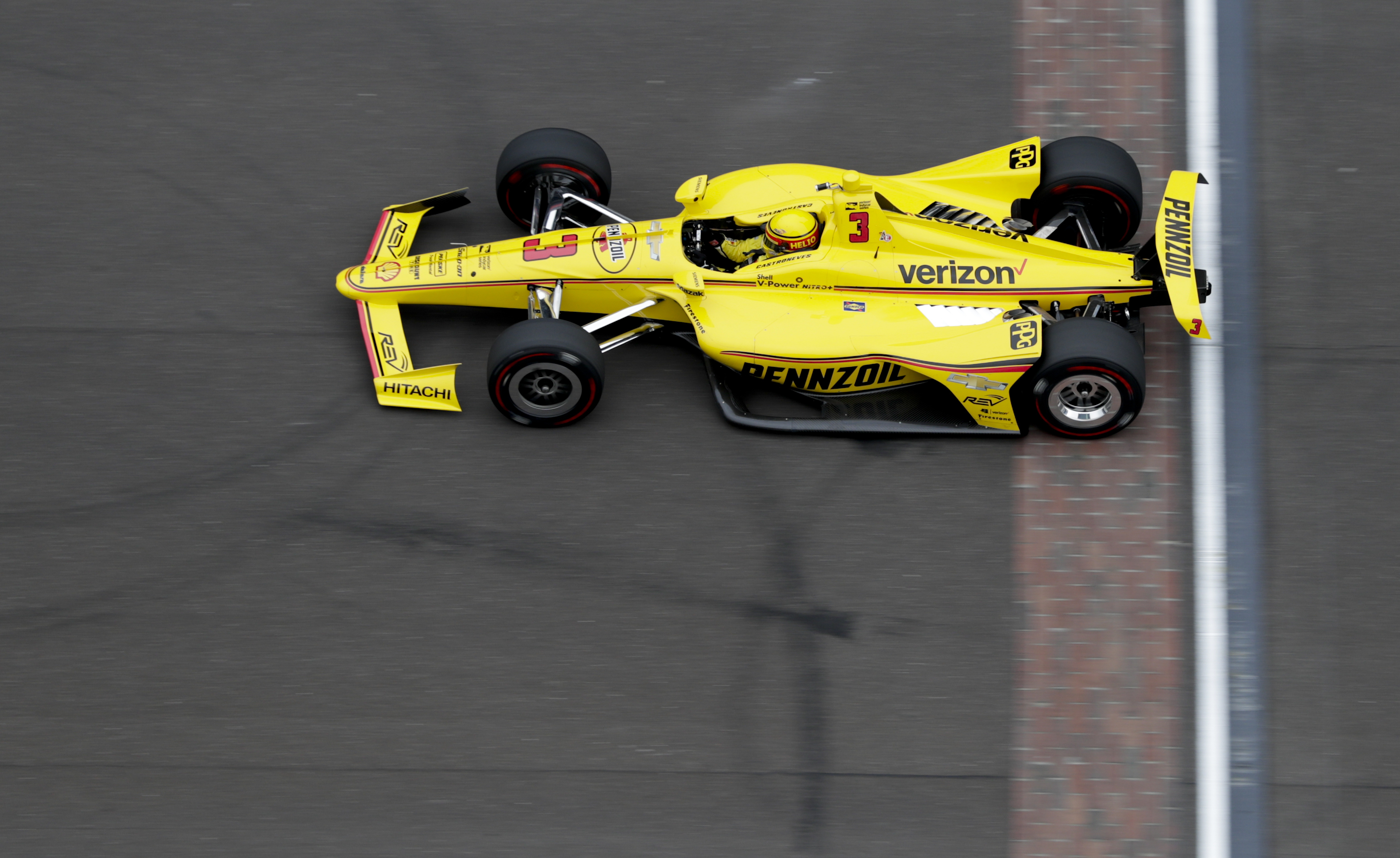 The Latest: Castroneves claims top spot in Indy qualifying