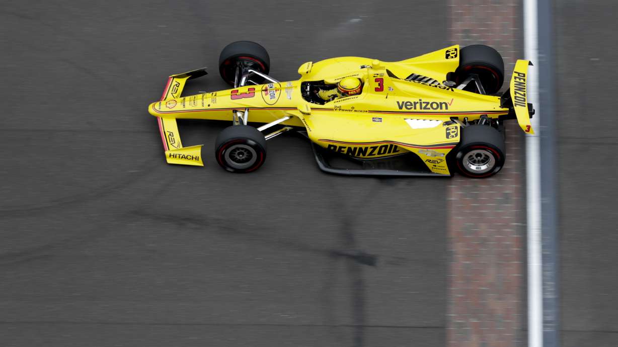The Latest: Castroneves claims top spot in Indy qualifying