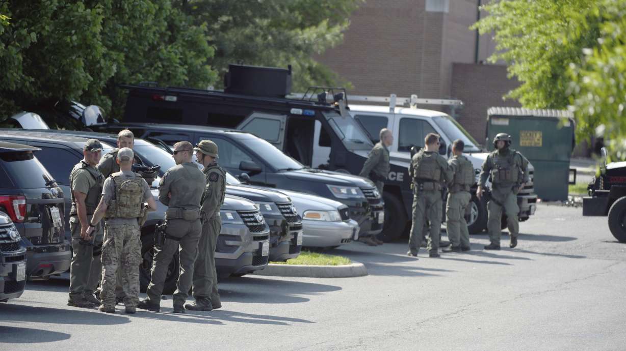 Police tweet that a teen was arrested shortly after a Baltimore County police officer's slaying, 3 others are sought