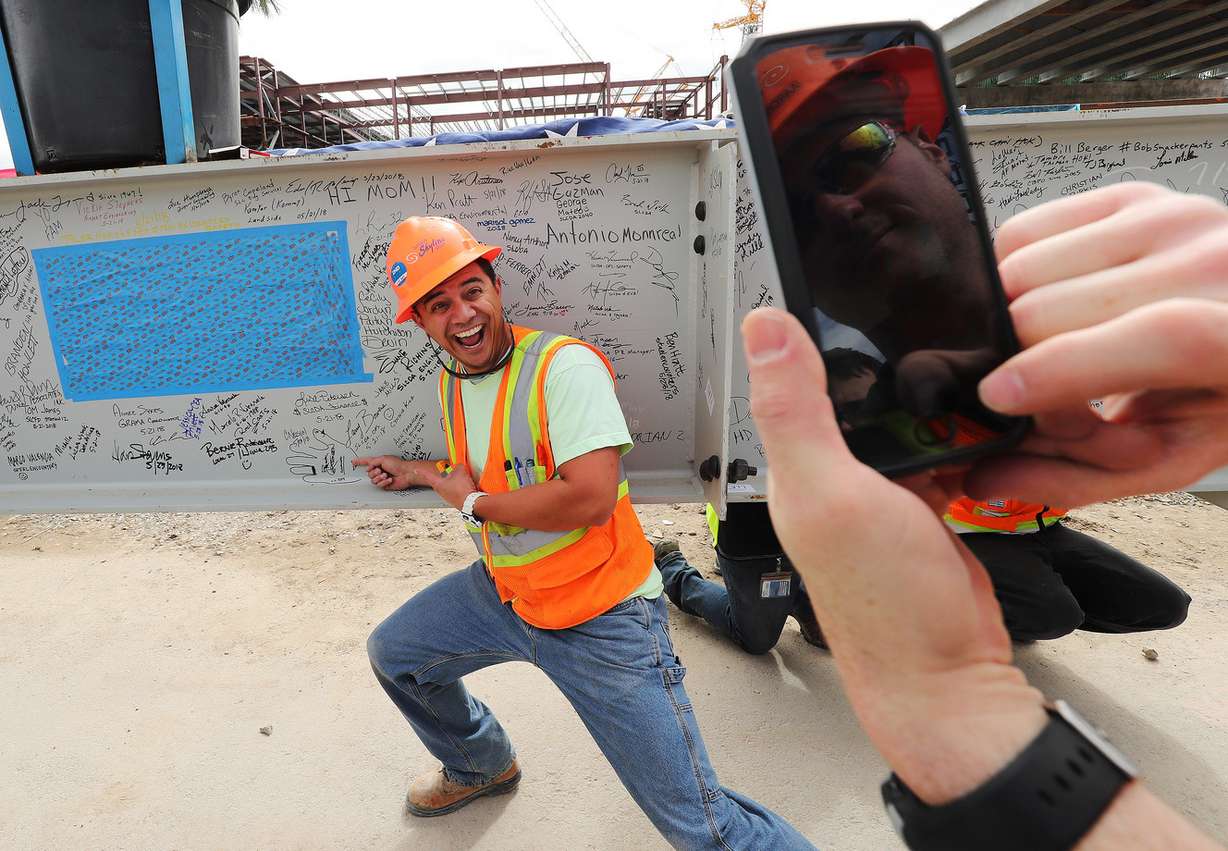 Forklift operator Brook Christensen has some fun during a topping-out ceremony for the new terminal at the Salt Lake City International Airport in Salt Lake City on Wednesday, May 23, 2018. (Photo: Jeffrey D. Allred, KSL)