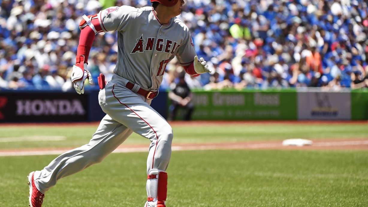Trout and Pujols hit solo HRs, Angels beat Blue Jays 8-1