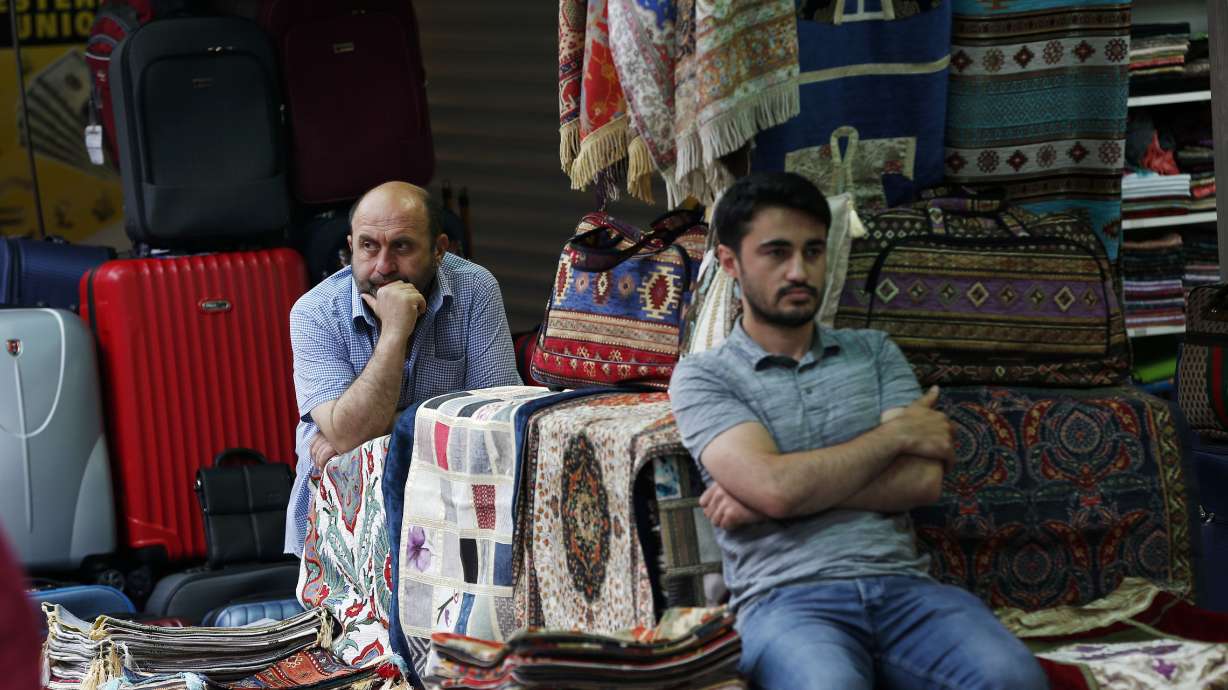 Turks feel pinch from currency slide ahead of polls