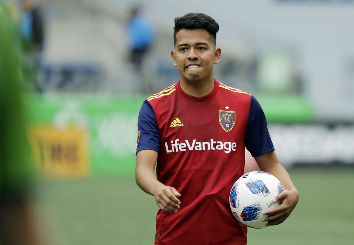 Real Salt Lake midfielder Sebastian Saucedo carries a game ball off the field following the team's MLS soccer match against the Seattle Sounders on Saturday, May 26, 2018, in Seattle. Sauccedo scored a goal in the second half that gave Real Salt Lake a 1-0 win. (Photo: Ted S. Warren, AP)