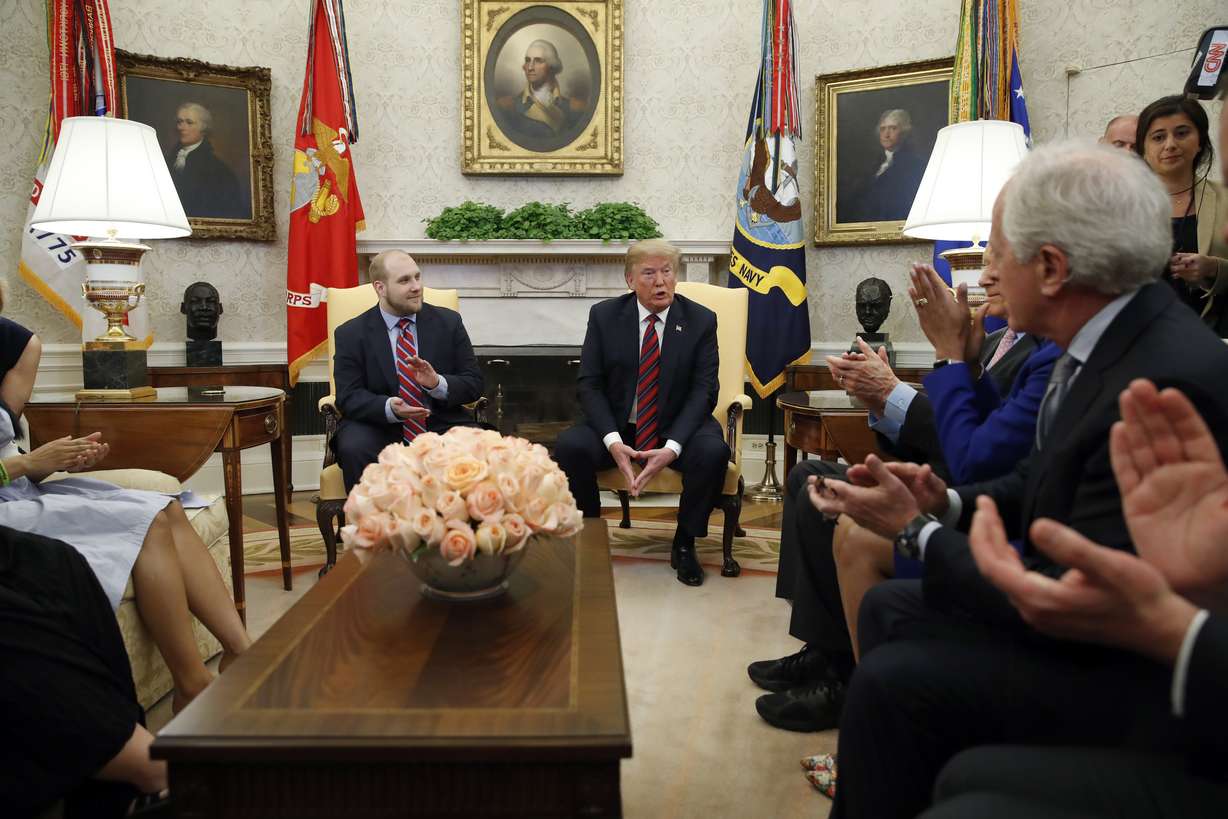 President Donald Trump, second from right, speaks as he sits with Joshua Holt, left who was recently released from a prison in Venezuela, with Sen. Bob Corker, R-Tenn., right, and others, in the Oval Office of the White House, Saturday, May 26, 2018, in Washington. (AP Photo/Alex Brandon)