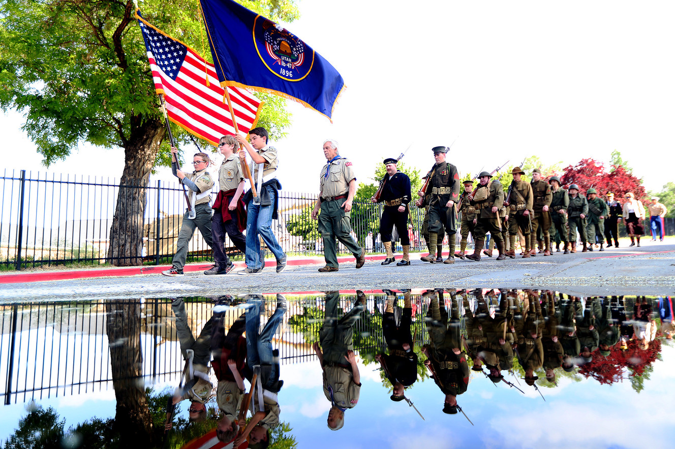 Members of the Utah Military History Group march to the cemetery as the Utah chapter of the Association of the United States Army conducts its annual Memorial Day service at Fort Douglas Military Cemetery on Monday, May 28, 2018. (Photo: Scott G Winterton, KSL)