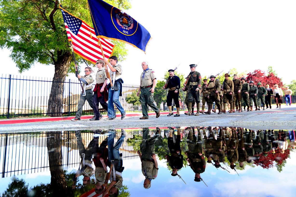 Members of the Utah Military History Group march to the cemetery as the Utah chapter of the Association of the United States Army conducts its annual Memorial Day service at Fort Douglas Military Cemetery on Monday, May 28, 2018. (Photo: Scott G Winterton, KSL)