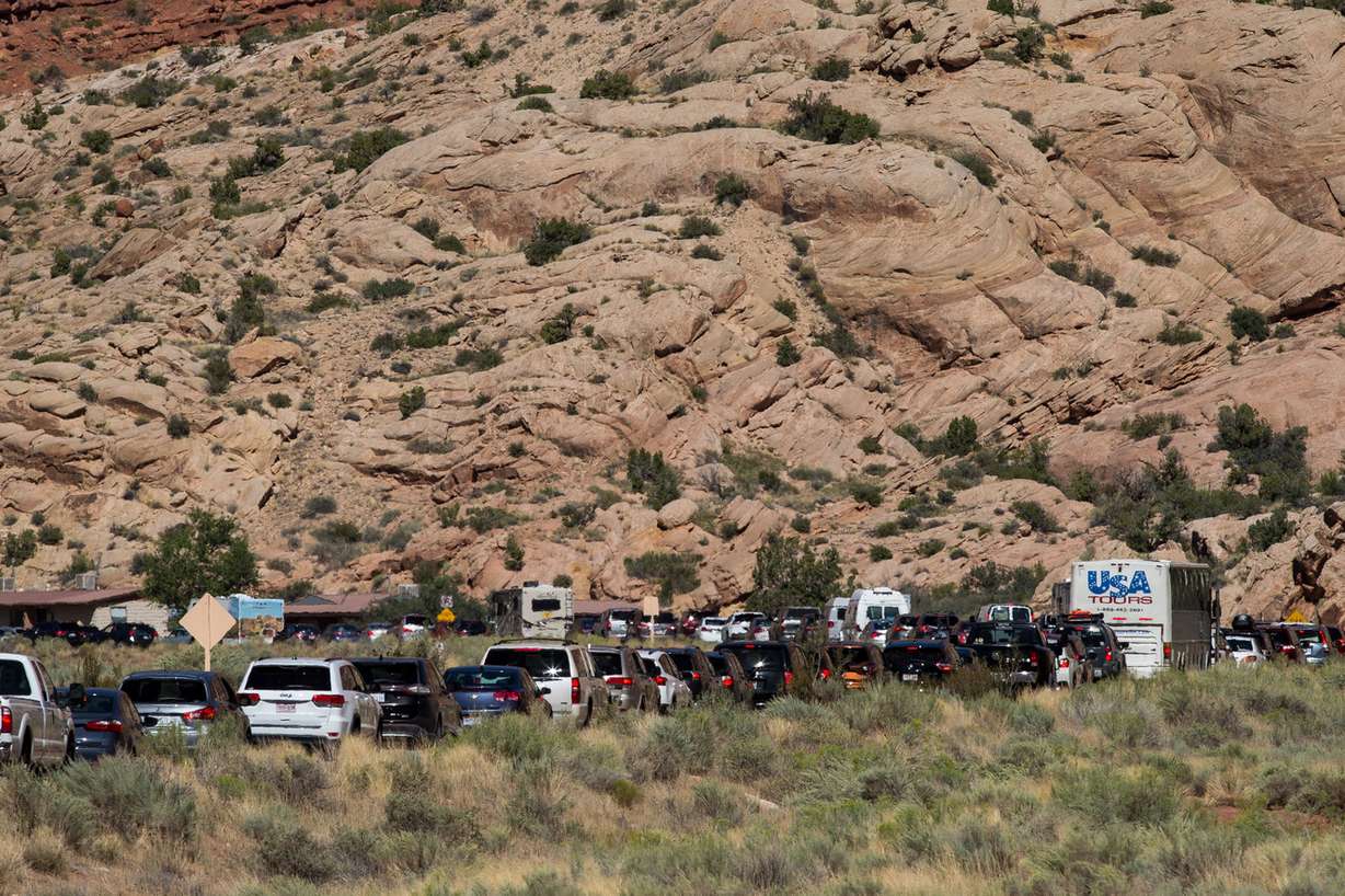 People gather to watch the sunset at Delicate Arch in Arches National Park on Thursday, Sept. 8, 2016. (Photo: Spenser Heaps, KSL, File)