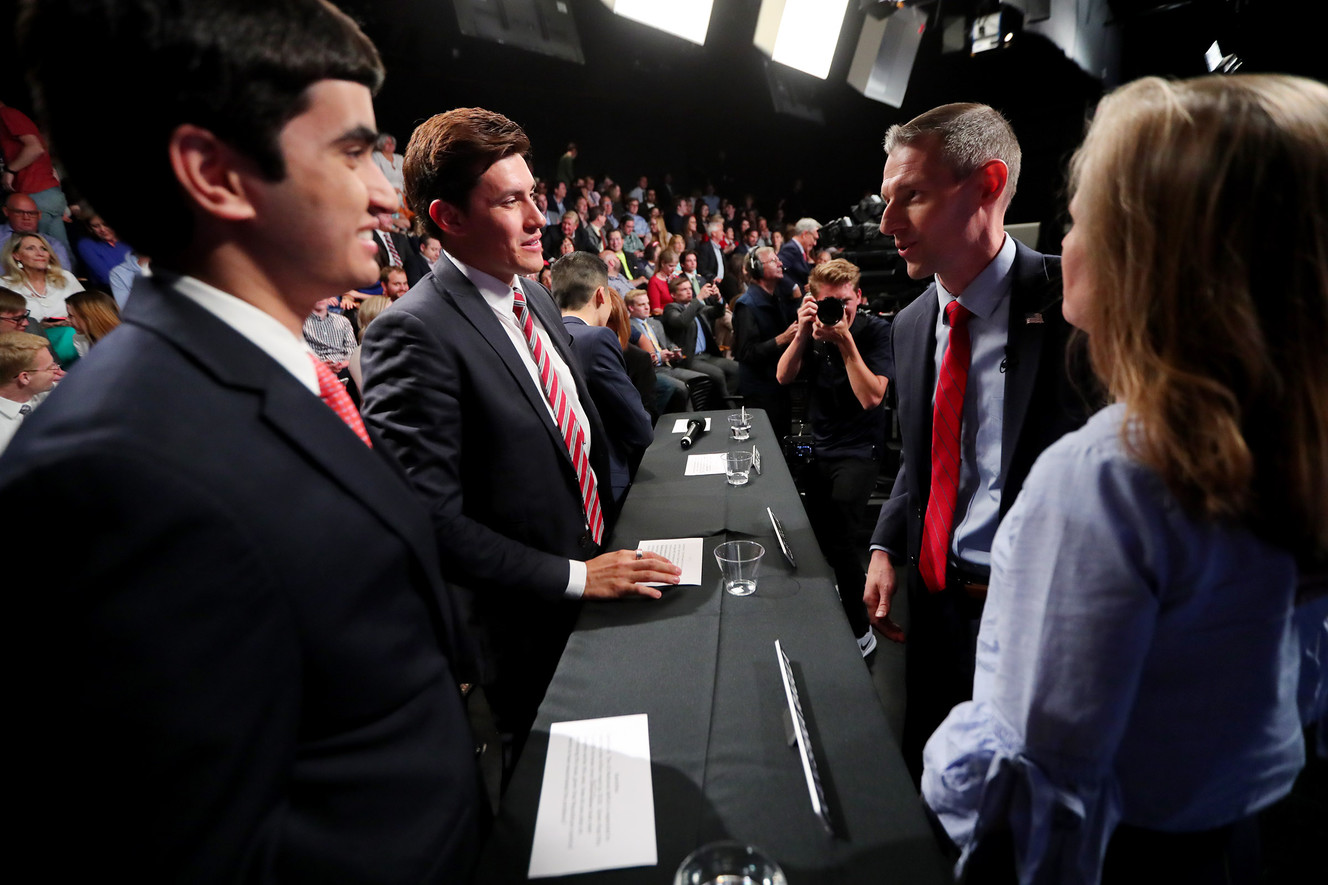 Rep, Mike Kennedy and his wife Katrina Kennedy talk with panel members Kanishka Ragula and Aled Trujillo following the debate with Mitt Romney in Provo on Tuesday, May 29, 2018. (Photo: Scott G Winterton, KSL)