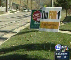 Both Sides of Voucher Debate Report Stolen Signs